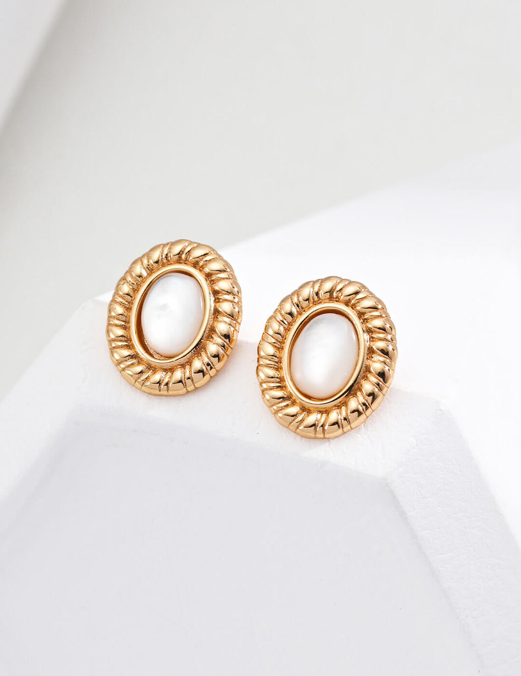 Front view of minimalist shell stud earrings in S925 sterling silver.