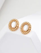 Front view of minimalist shell stud earrings in S925 sterling silver.