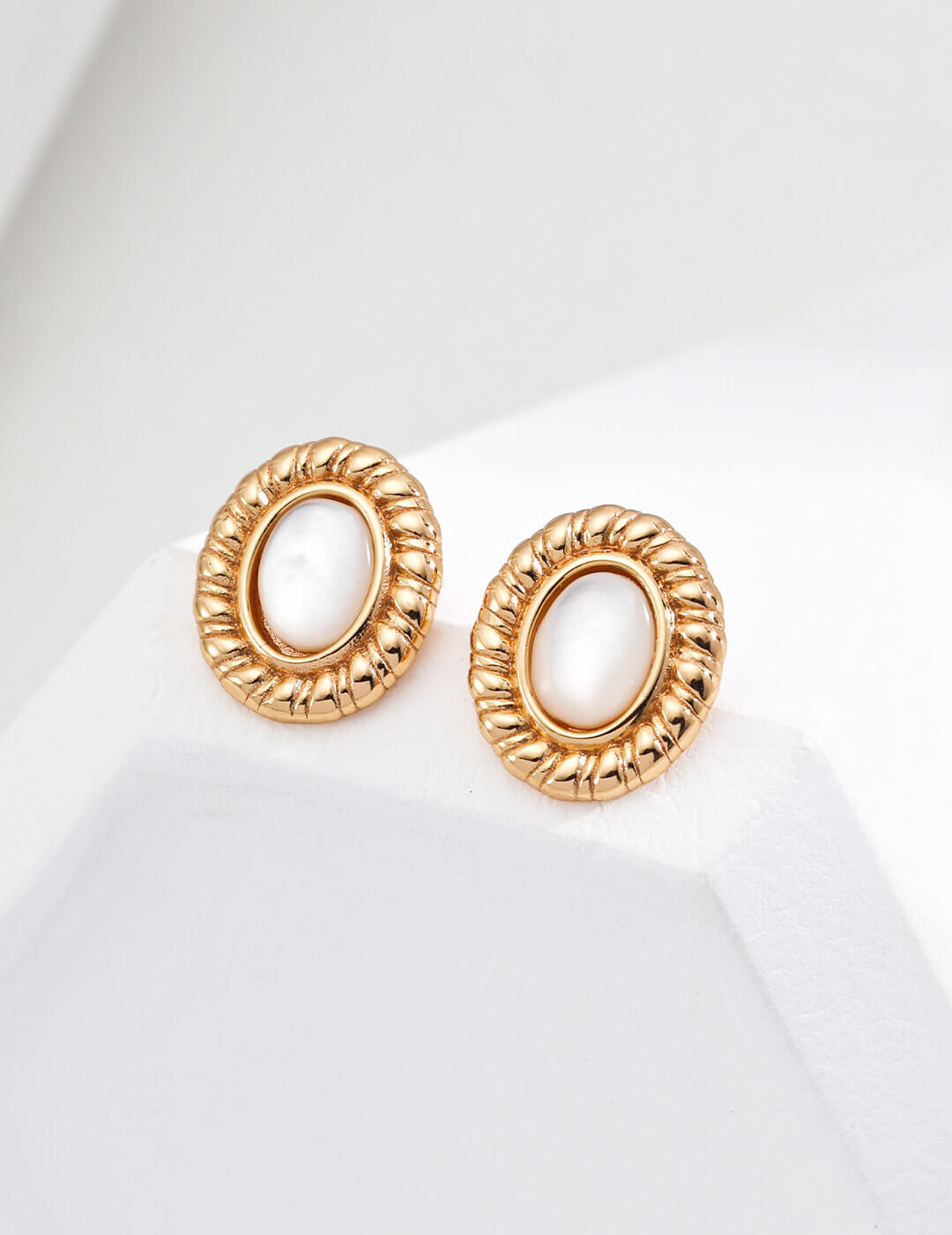 Front view of minimalist shell stud earrings in S925 sterling silver.