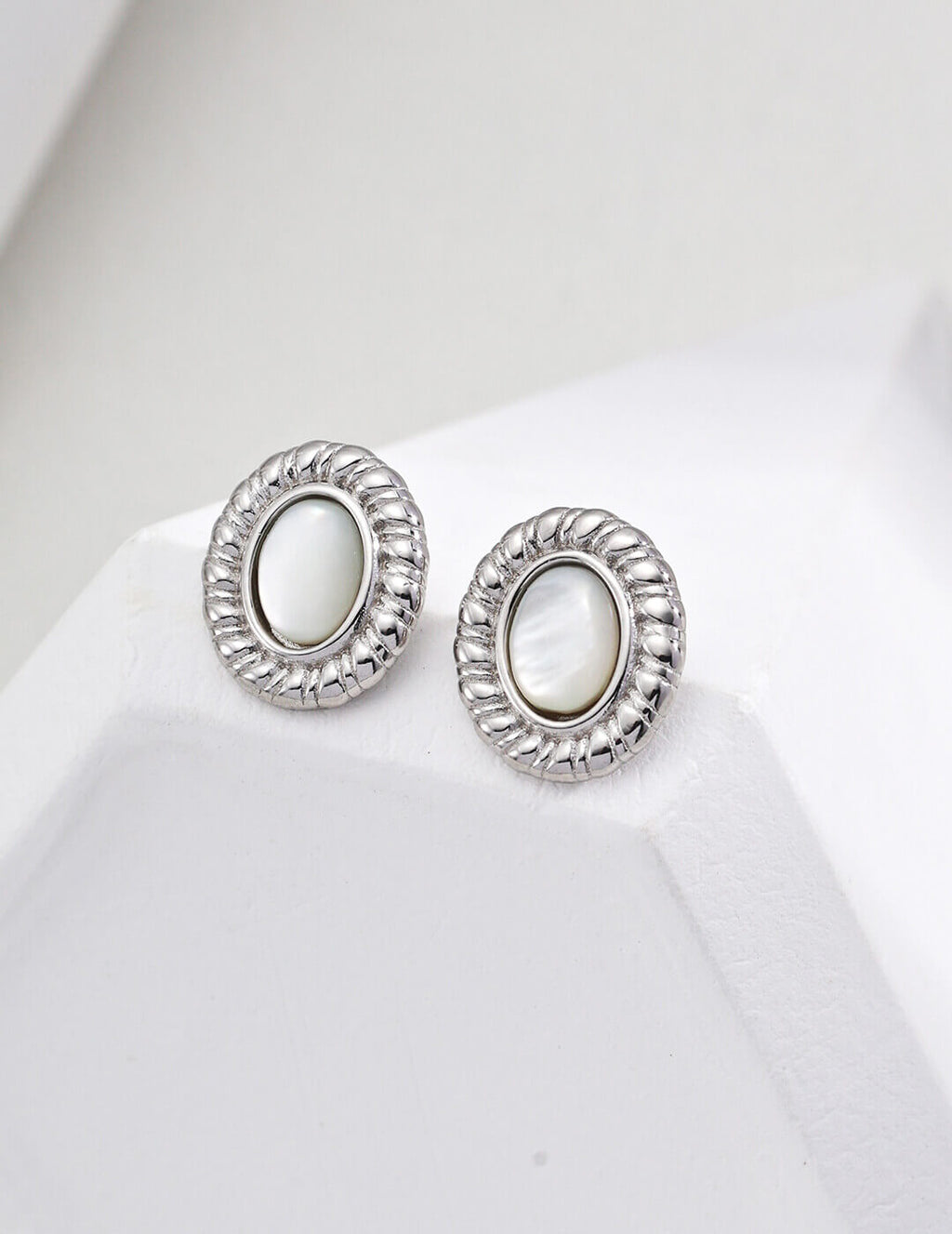 shell stud earrings in classic Silver plating.