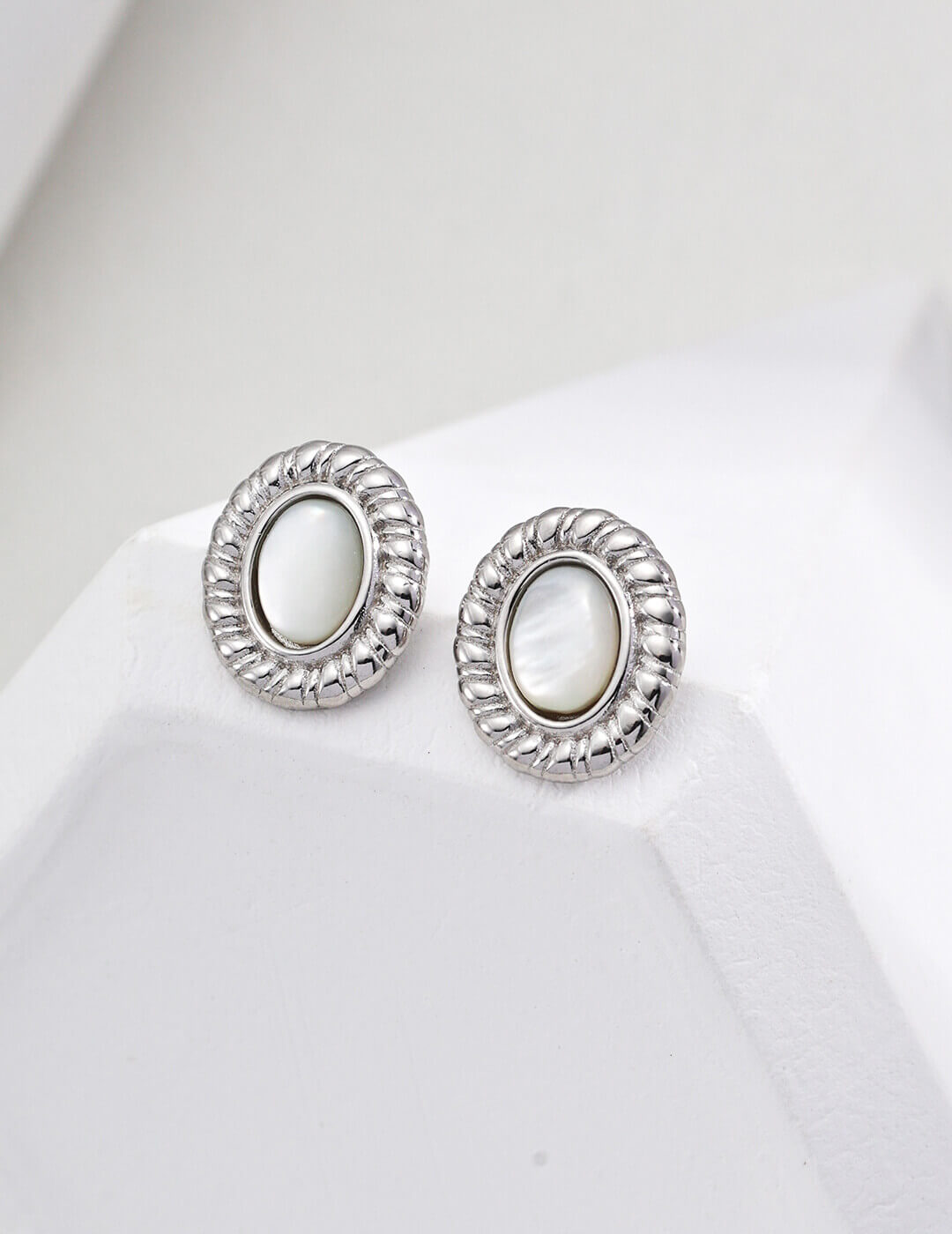 shell stud earrings in classic Silver plating.