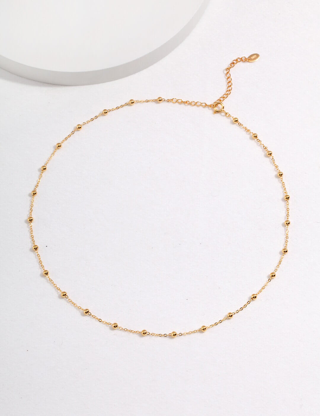 Gold necklace on a white background