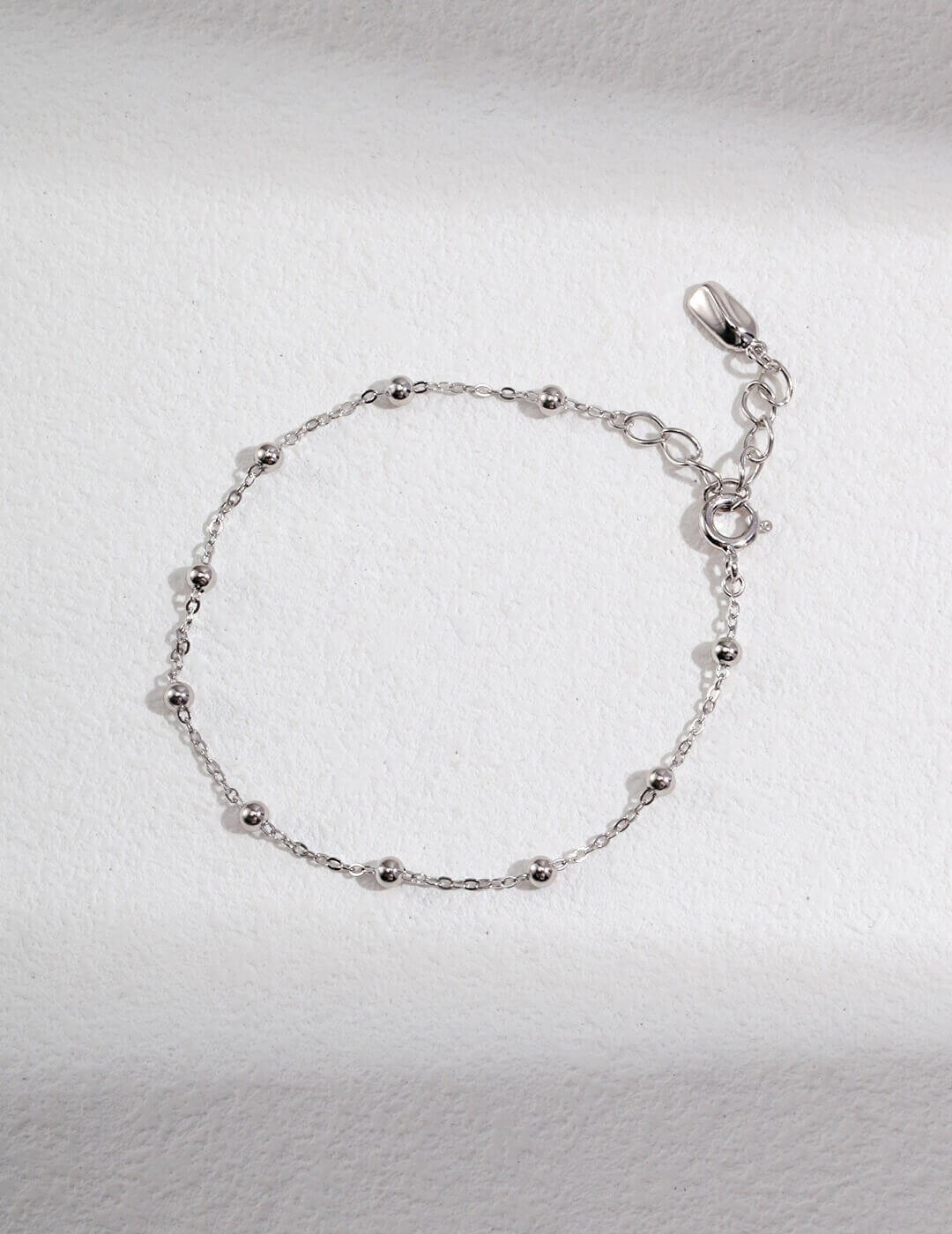 Solo shot of the dainty S925 silver bracelet from the set.