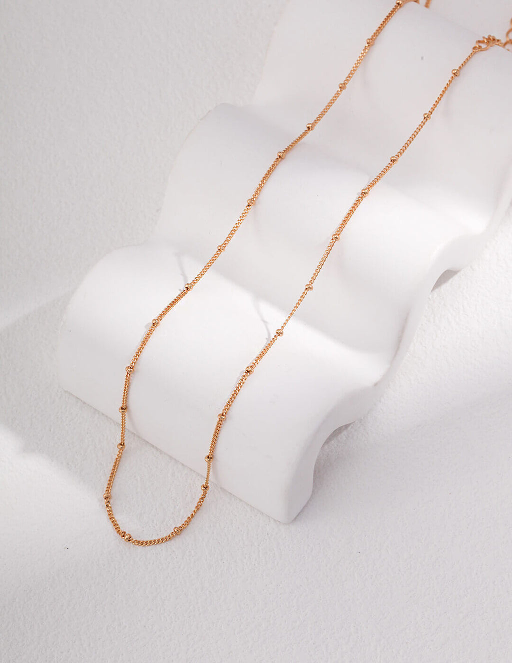 The jewelry set adding a subtle elegance to a casual everyday outfit.