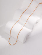 The jewelry set adding a subtle elegance to a casual everyday outfit.