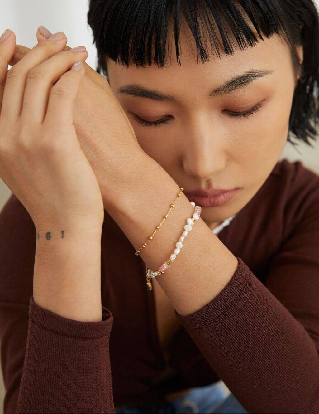 The bracelet and necklace set beautifully arranged inside an open gift box.