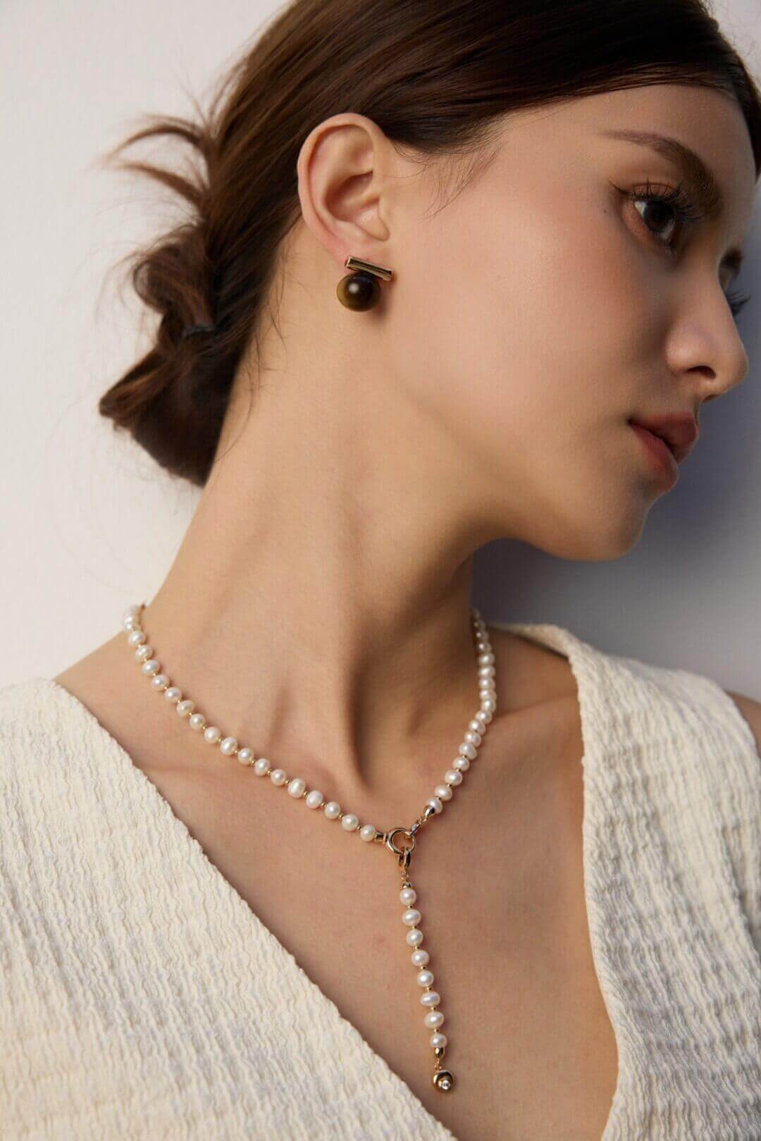 The earrings showcased on a dark background to make the stones pop.
