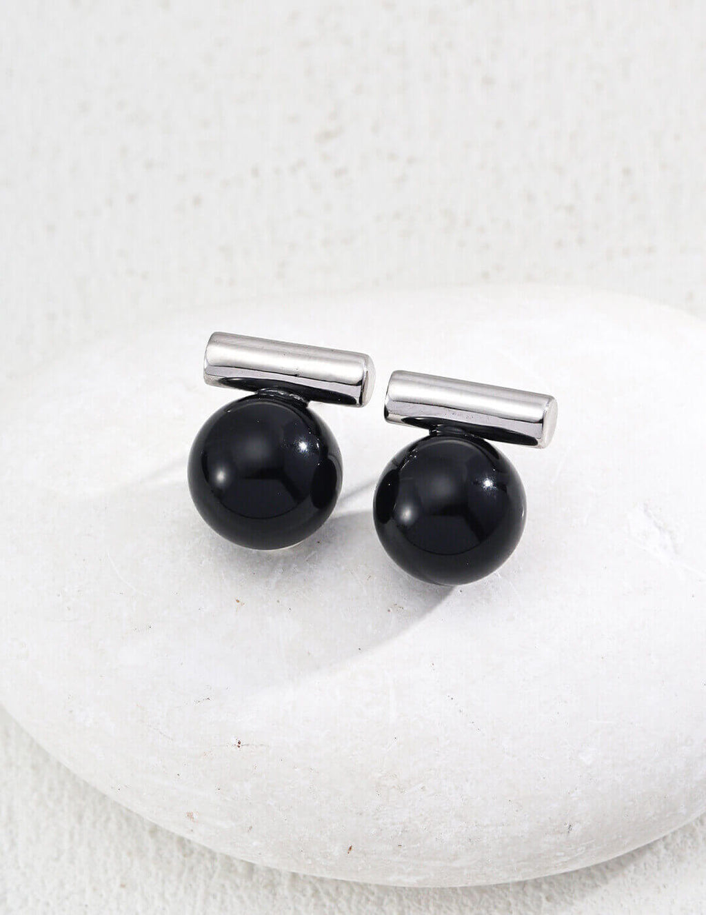 Model wearing the Silver plated version of the stud earrings.