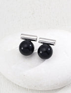 Model wearing the Silver plated version of the stud earrings.