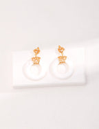 Minimalist white shell earrings in S925 sterling silver, featuring an exquisite vintage-inspired hollow-out design.