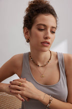 Model wearing one style of the convertible earrings with a casual daytime outfit.