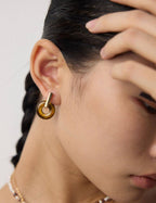 Model showcasing the Tiger's Eye ear cuff worn as the first style (close-up).
