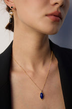 Female model wearing vintage Lapis Lazuli necklace - neck closeup.