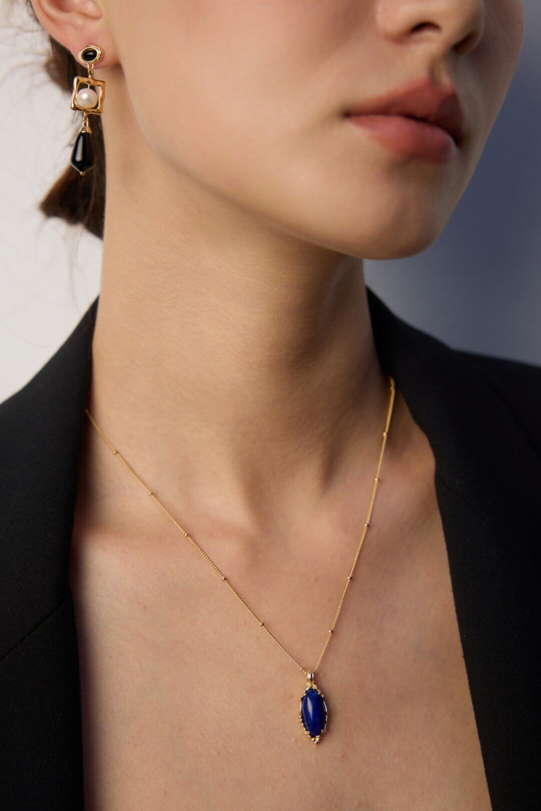 Female model wearing vintage Lapis Lazuli necklace - neck closeup.