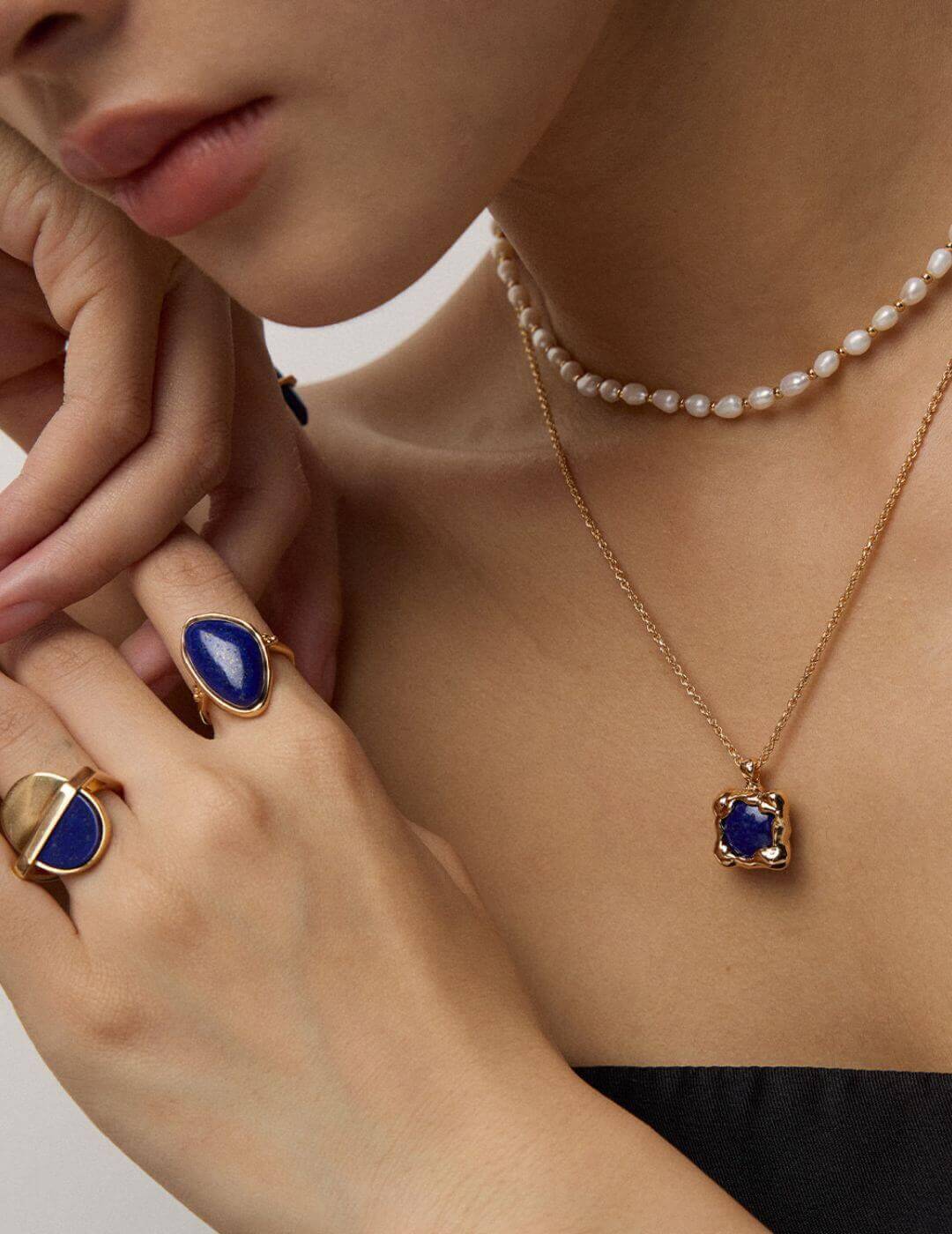 Professional woman wearing the necklace in business casual setting.