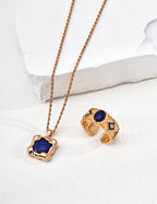 Model showcasing vintage gold version of lapis lazuli necklace.