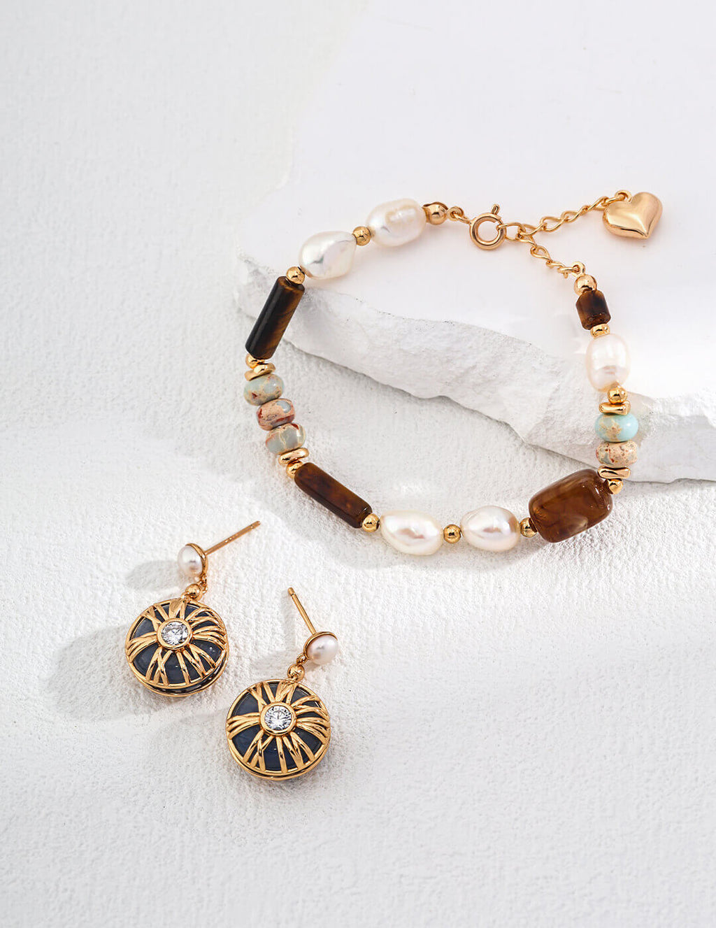Bracelet and earrings set on a white background