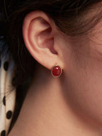 Lifestyle shot showing the earrings adapting to different daily contexts.