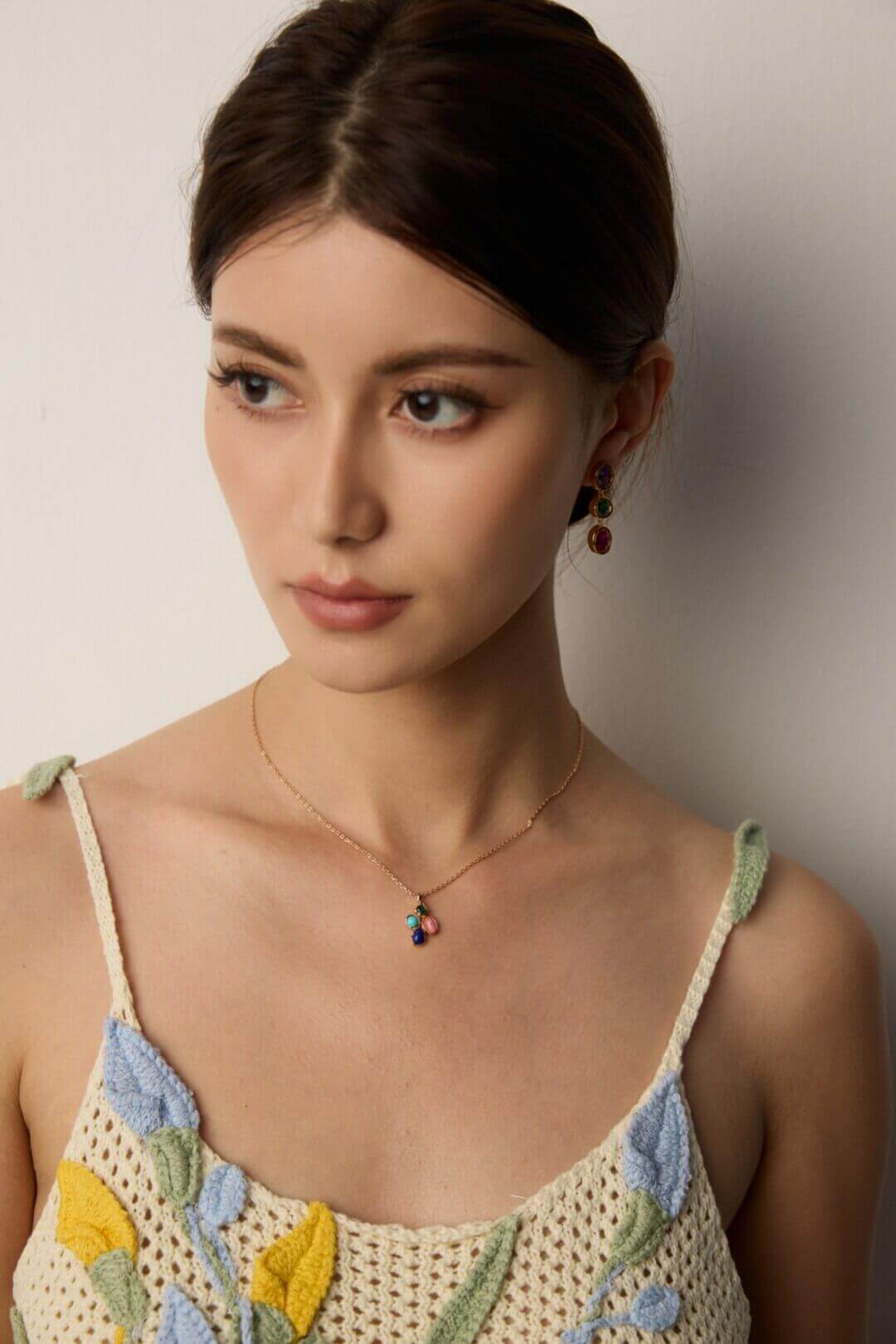 Model wearing the necklace with a bohemian-style dress, emphasizing its vintage charm.