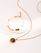 The pendant with boho-style clothing, emphasizing its earthy, artistic vibe.