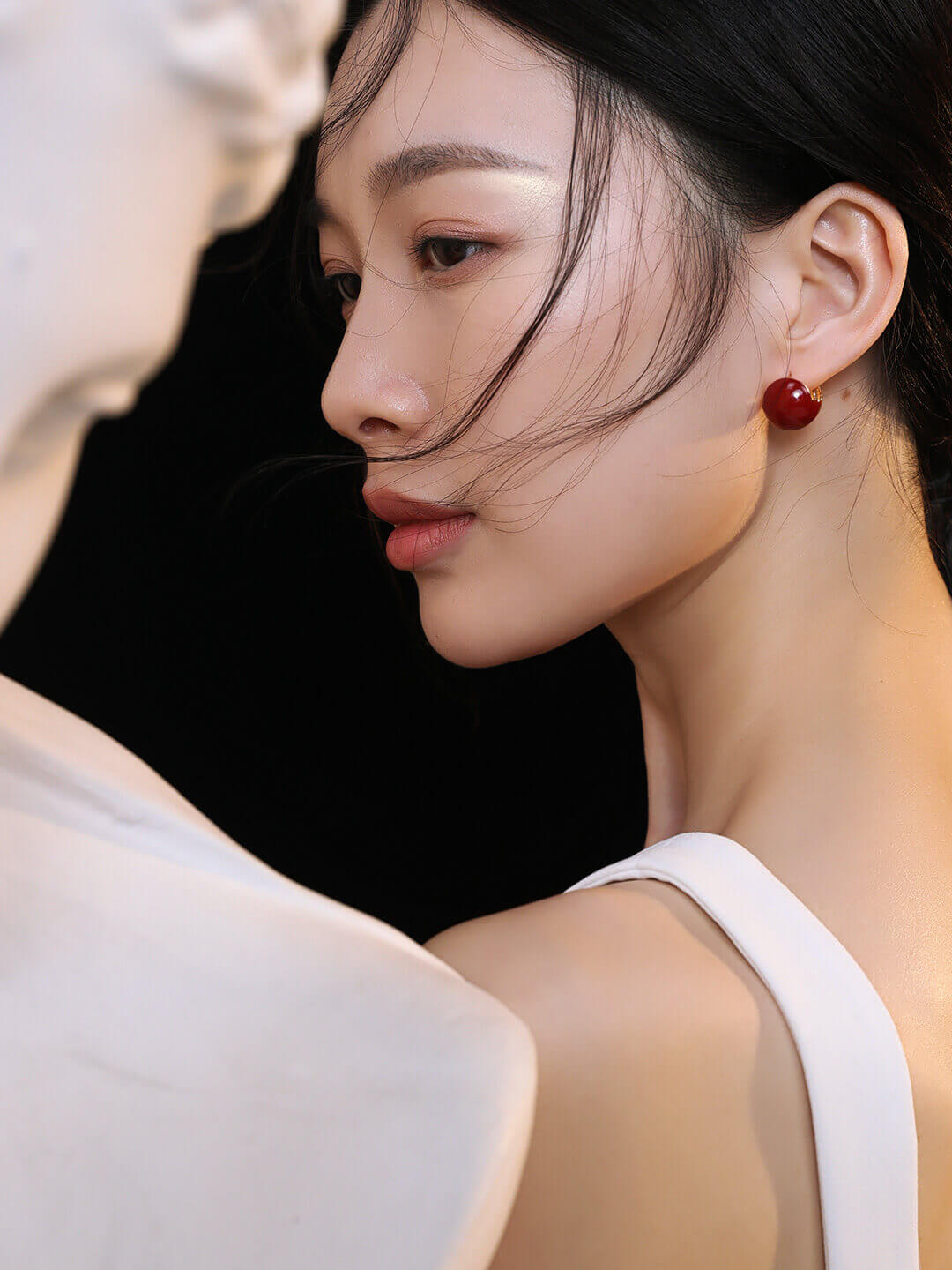 Modern red enamel earrings elevating casual chic style with their K gold plating and vibrant hue.
