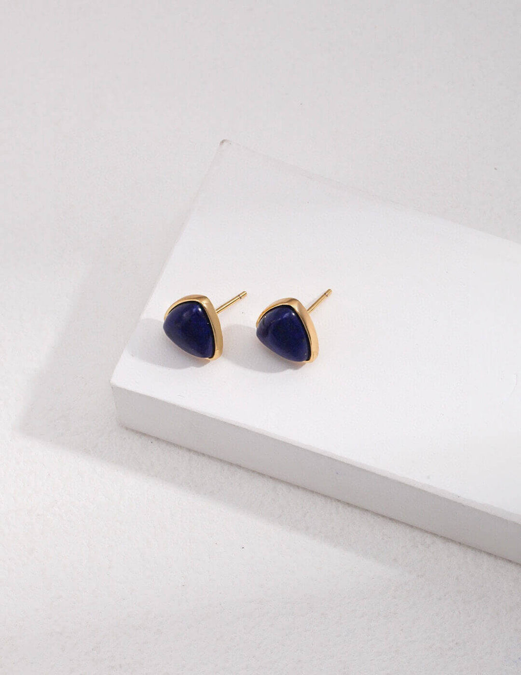 Natural Lapis Lazuli stud earrings in 925 sterling silver with warm K-gold plating, showcasing deep celestial blue gemstones.