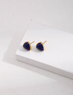 Natural Lapis Lazuli stud earrings in 925 sterling silver with warm K-gold plating, showcasing deep celestial blue gemstones.