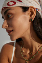 Detail shot highlighting the vintage gold setting and the polished malachite gemstone.