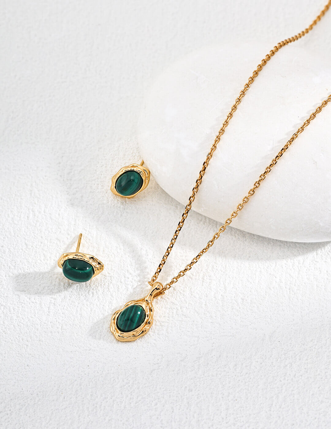 The natural malachite stud earrings elegantly displaye