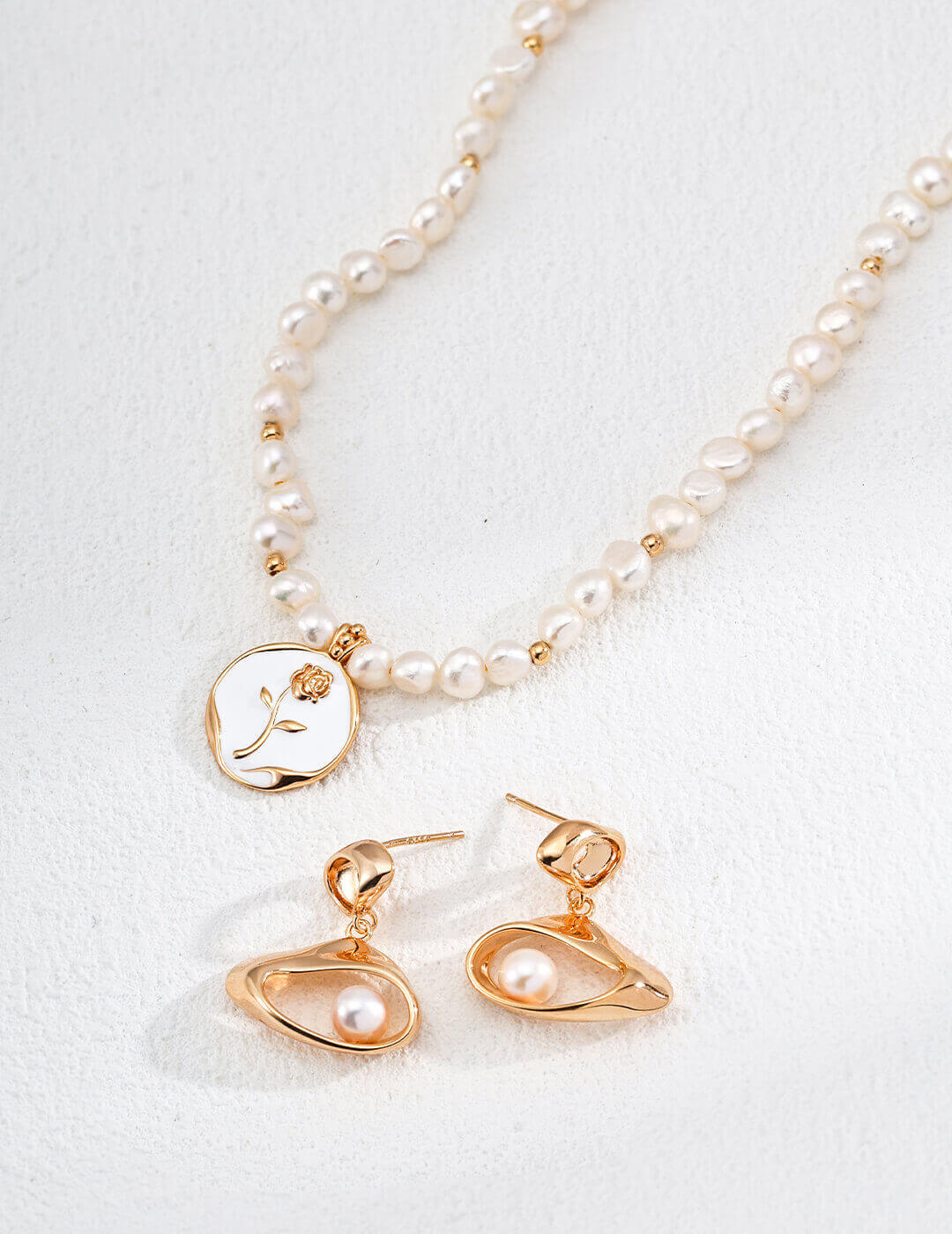 Natural pearl beautifully paired with the enamel rose, embodying a modern and sophisticated style.