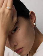 Back and secure post detail of the pearl stud earrings.