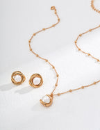Size comparison showing the 1.5cm pearl studs on a finger.