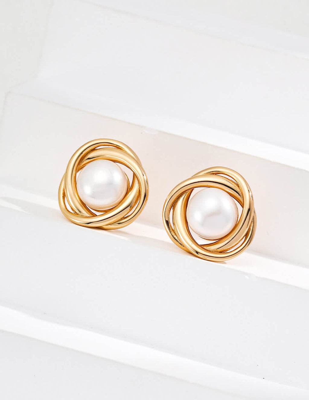 Back and secure post detail of the pearl stud earrings.