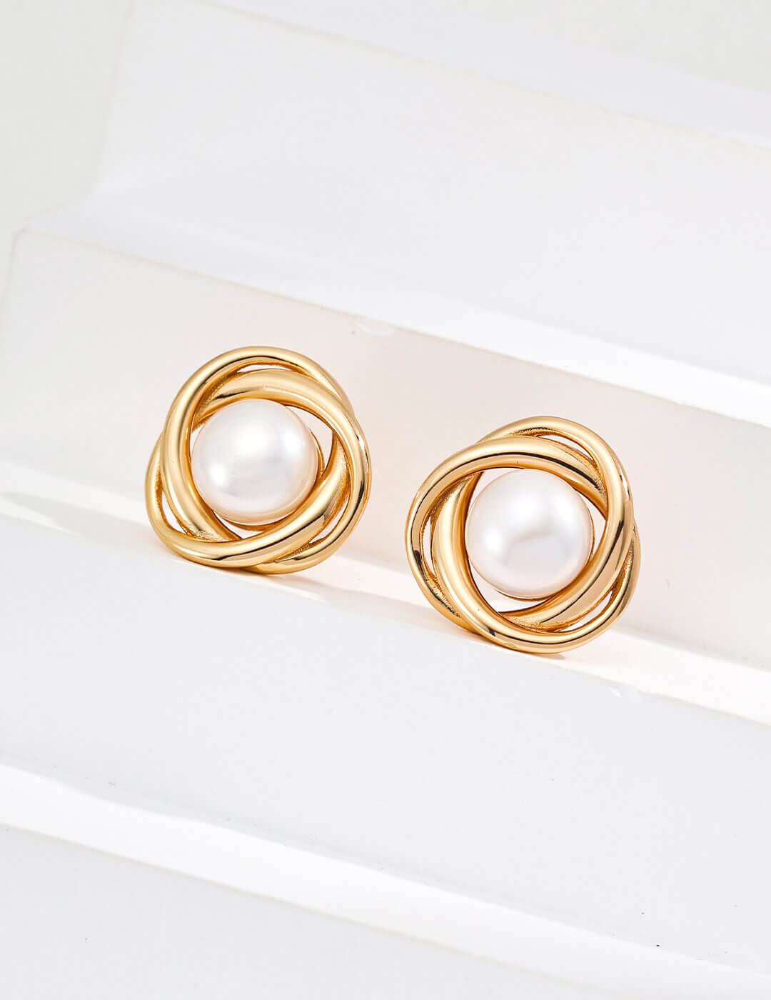 Back and secure post detail of the pearl stud earrings.