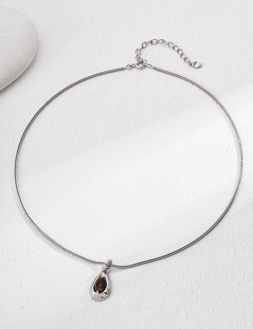 Tiger's Eye pendant necklace with silver plating and chain.