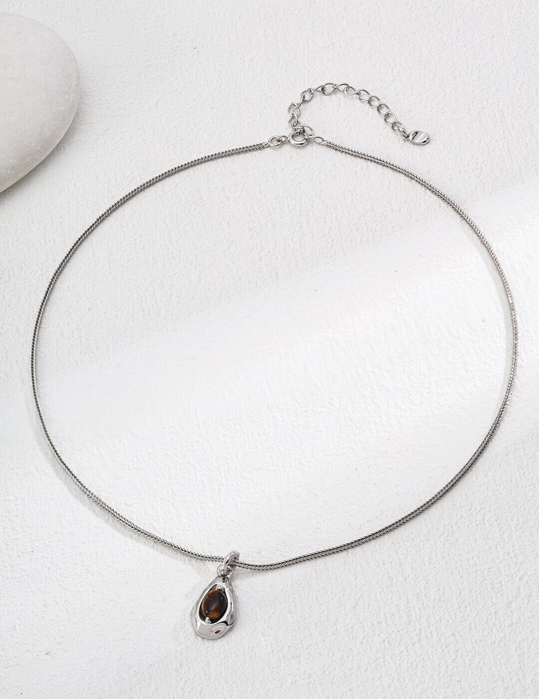 Tiger's Eye pendant necklace with silver plating and chain.