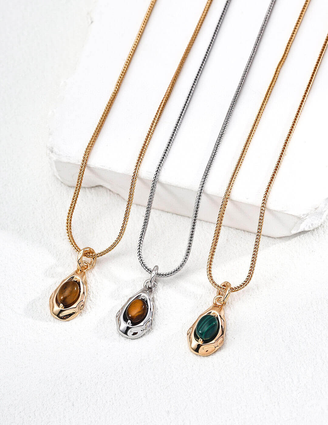 Front view of natural Tiger's Eye pendant necklace on model.