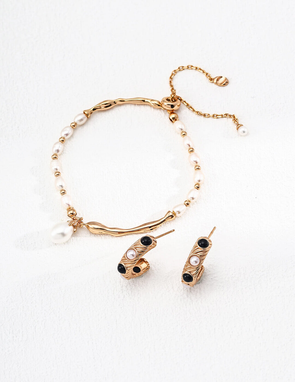 Natural pearl with soft organic luster and unique surface characteristics in vintage-inspired setting.