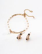 Natural pearl with soft organic luster and unique surface characteristics in vintage-inspired setting.