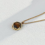 The pendant with boho-style clothing, emphasizing its earthy, artistic vibe.