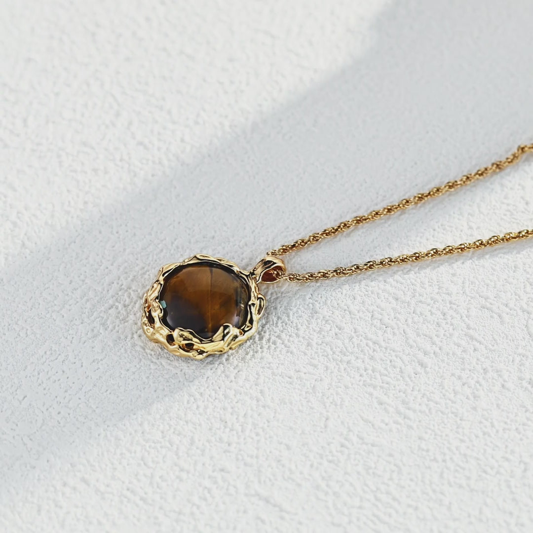 The pendant with boho-style clothing, emphasizing its earthy, artistic vibe.