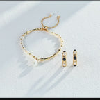 Timeless vintage pearl and onyx stud earrings in natural lifestyle setting, showcasing everyday elegance.