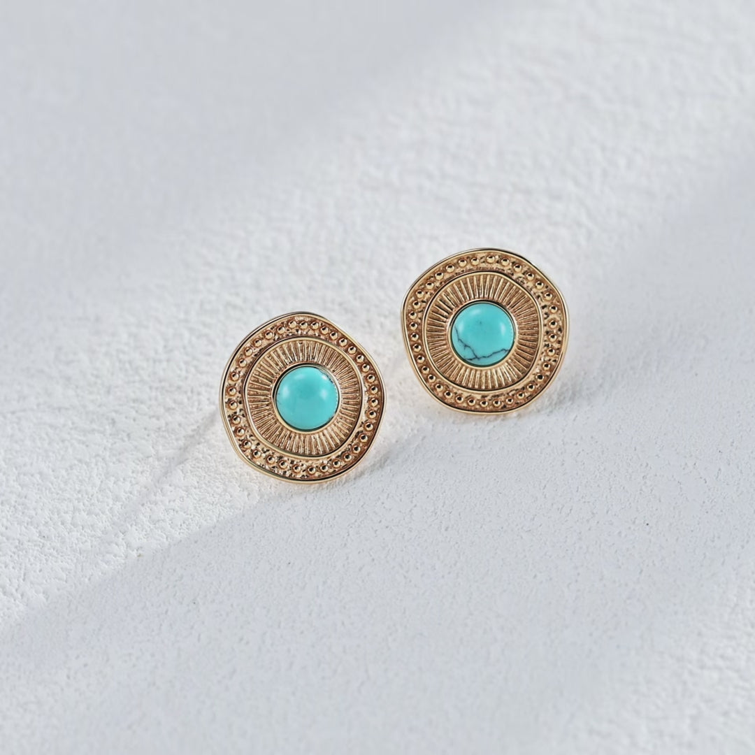 Vintage turquoise stud earrings coordinated with other retro accessories for a cohesive look.