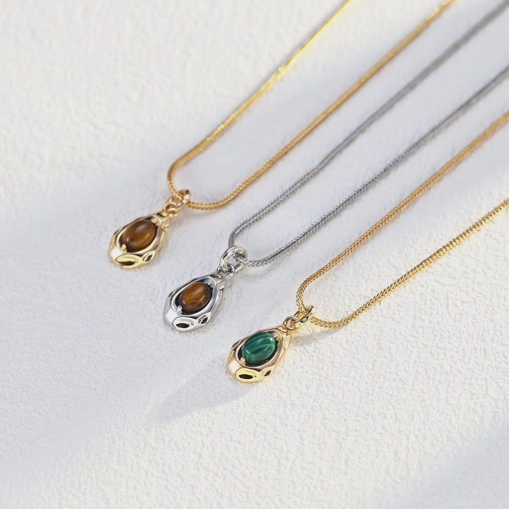 Model showing Tiger's Eye necklace from different wearing angles.