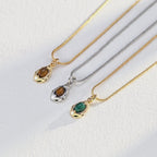 Model showing Tiger's Eye necklace from different wearing angles.