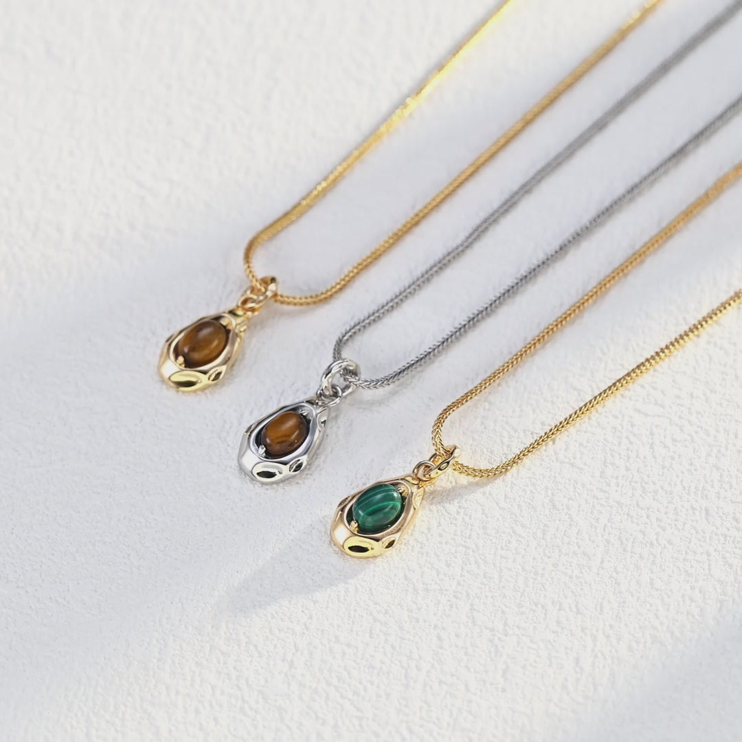 Model showing Tiger's Eye necklace from different wearing angles.