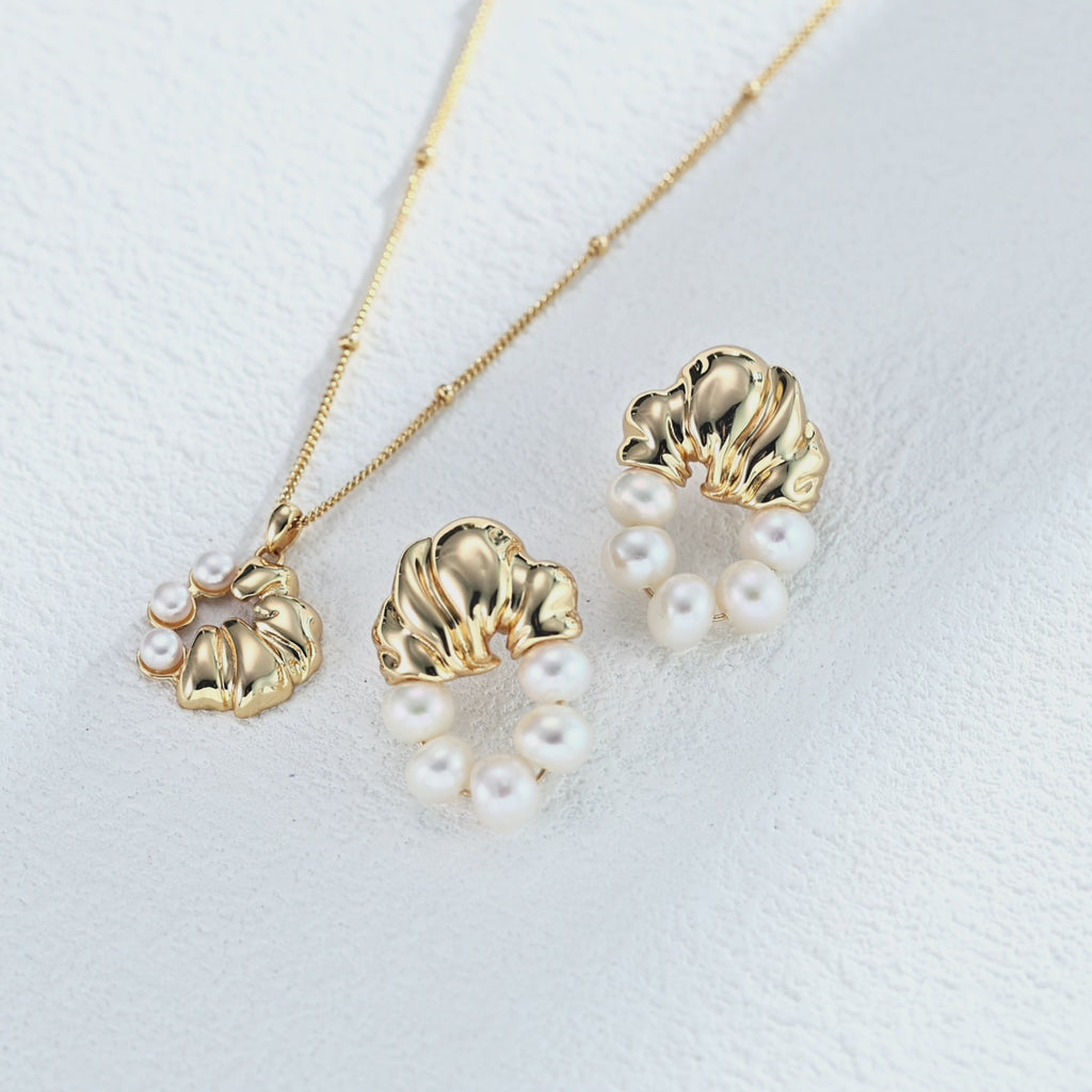 vintage-pearl-earrings-styling.jpg	Vintage pearl earrings styled with classic jewelry collection.