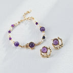 Liquid metal and amethyst earrings catching the light, showcasing the metallic luster and gemstone brilliance.
