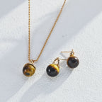 Earrings elegantly displayed inside open gift box ready for gifting.