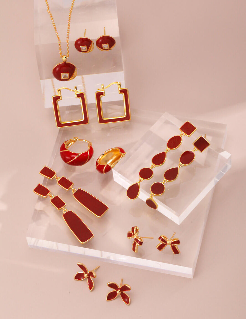Profile view of red enamel drop earrings showing elegant silhouette and comfortable drop design.